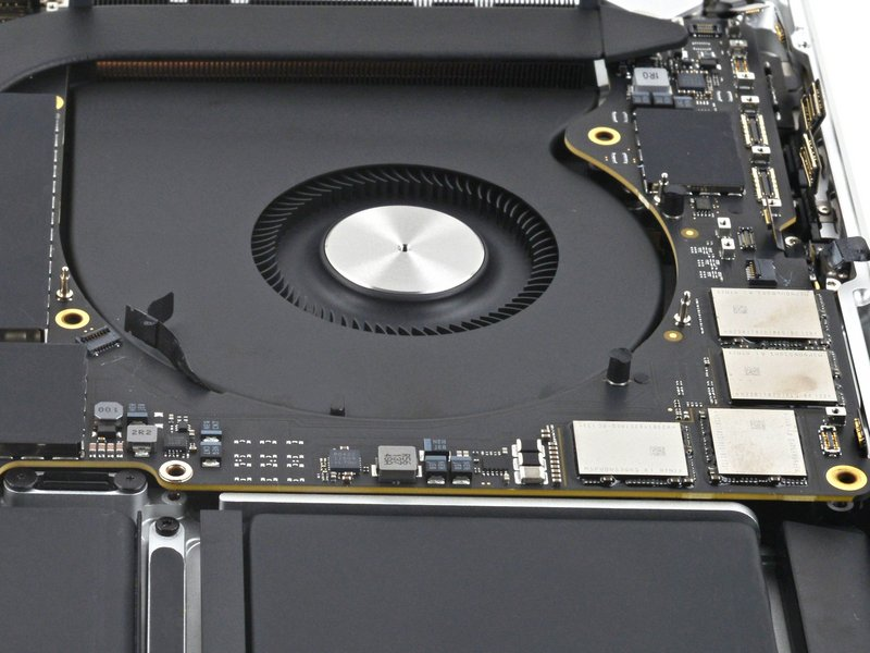 Inside of a MacBook showing cooling fan and logic board – Dead or Alive Technology offers loud fan repair, overheating fixes, and cleaning services in Wishaw, North Lanarkshire.